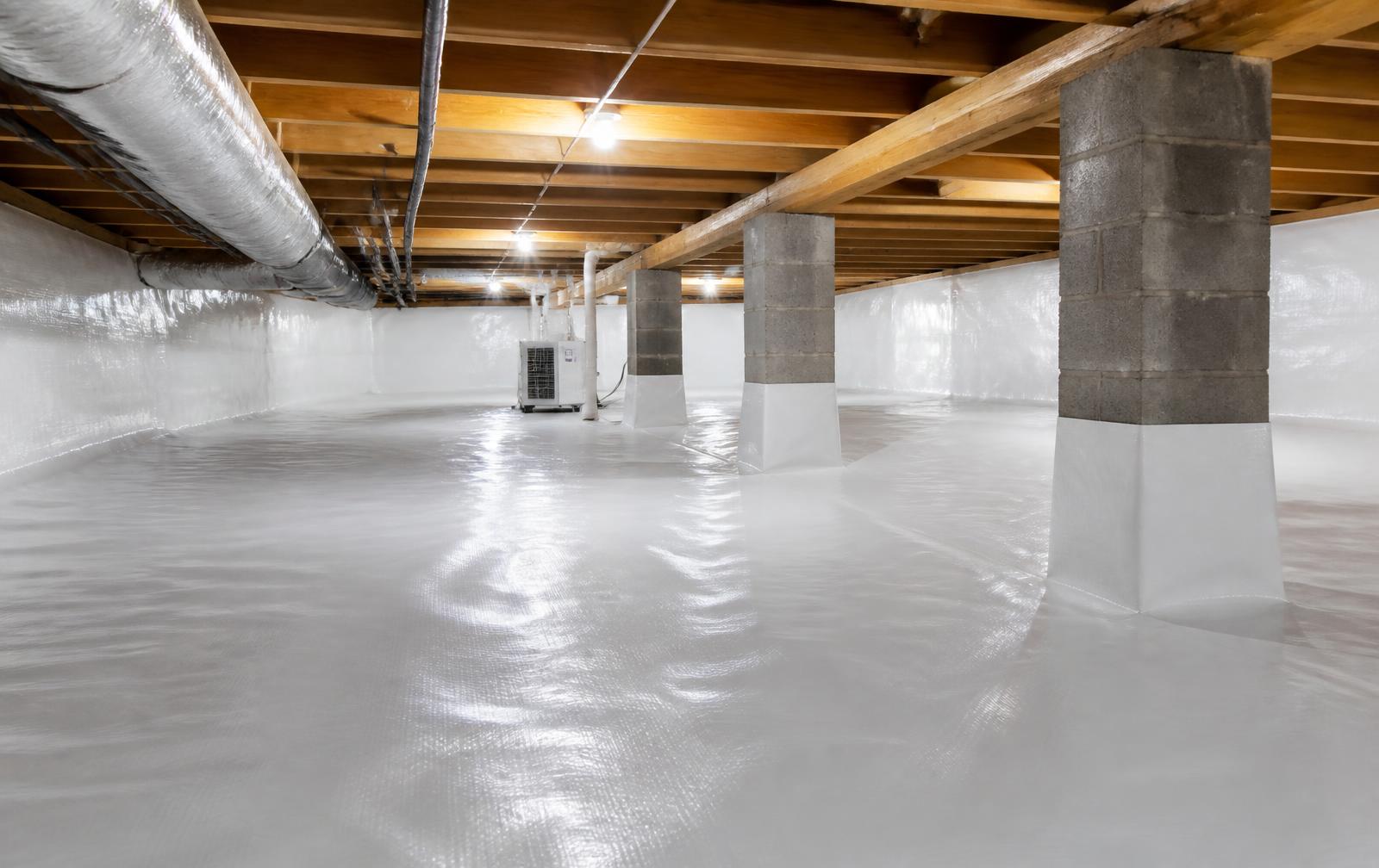 Encapsulated crawlspace with a bright white vapor barrier and dehumidifier